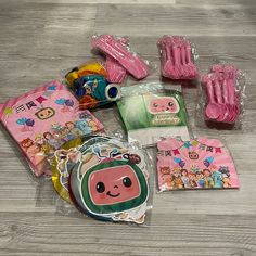 various items are laid out on the floor to be used as gifts for children's birthdays