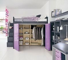 an organized bedroom with purple and black furniture