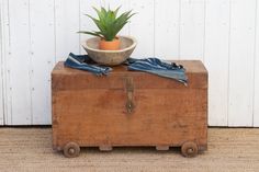 "Antique campaign chest, originally designed for travelers. Crafted from durable teak wood and adorned with original brass carrying side handles, this chest is a testament to craftsmanship and heritage. Its authentic charm lies in the oxidize finish that showcases the character of the wood. The top of this antique campaign chest opens to reveal a small interior compartment, adding to its versatility and functionality. Whether as a decorative piece, a coffee table or a practical storage solution, this chest carries the stories of journeys and adventures. *Era: Antique *Material: Teak *Size: 36\"(L) x 18\"(D) x 20.5\"(H) *Color: Brown *Condition: Wear consistent with age & use, blemishes and imperfections will be present. These are not to be consider defects but rather part of its character Campaign Chest, Chest Opening, Studio Photography Lighting, Wooden Statues, Bench Furniture, Storage Solution, Teak Wood, A Coffee, Storage Solutions