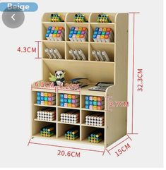 the wooden toy organizer is filled with different colored cubes and numbers on it's sides