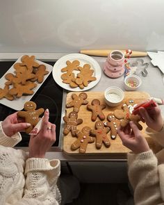 two women are making ginger cookies on the table