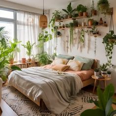 a bedroom with lots of plants on the wall and a bed in front of it