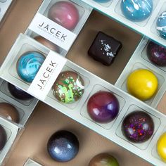 there are many different colored chocolates in the box