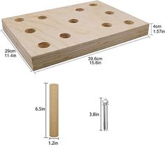 a wooden board with holes cut in half to show the size and width for each piece