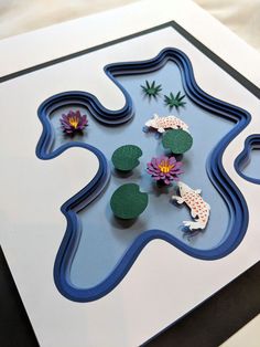 an art project with paper flowers and water lilies