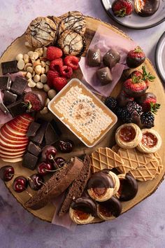 an assortment of desserts and pastries on a platter