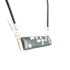 This awesome personalized pendant necklace has the braille translation of the Your Name or any other 6 letter, or less, word. The pendant is made of polymer clay pressed into a silver-plated cabochon type pendant blank and has black metal dots that are raised, smooth and easy to read.  The piece is glazed for shine and protection.  Size: 2 inches long by 1/2 inch wide (50mm x 13mm) Includes a choice of chain/cord Please Note: * I will use a capital letter dot at the beginning of names if it will Braille Necklace, Personalized Pendant Necklace, Personalized Pendant, Grade 2, Some Words, Personalized Necklace, Necklace Pendant, Your Name, Black Metal