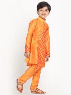 VASTRAMAY Boys Orange Ethnic Motifs Angrakha Kurta with Pyjamas An ideal blend of tradition and style, this VASTRAMAY Boys Orange Ethnic Motifs Angrakha Kurta with Pyjamas is perfect for festive occasions. The kurta features ethnic motifs, giving it a traditional look with a modern twist. Features: Ethnic motifs for a traditional look Angrakha style adds a stylish twist Comfortable and breathable fabric Comes with matching pyjamas Perfect for festive occasions Specifications: Brand: VASTRAMAY Co Bollywood Style Sets With Motifs For Eid, Festive Eid Sets With Motifs, Festive Orange Art Silk Sets, Long Sleeve Bandhani Print Sets For Puja, Festive Bollywood Sets With Traditional Patterns, Bollywood Style Kurta With Motifs For Eid, Long Sleeve Sherwani For Puja With Traditional Patterns, Traditional Long Sleeve Churidar With Bandhani Print, Traditional Bandhani Print Sets For Festive Occasions