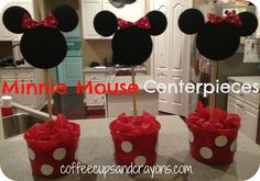 minnie mouse centerpieces with red bows and polka dots on them in the kitchen