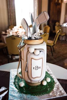 a golf themed cake is sitting on a table