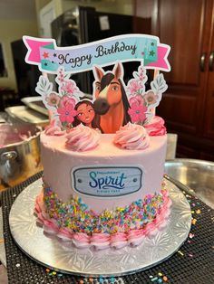 a birthday cake with frosting and sprinkles on the top is decorated like a horse