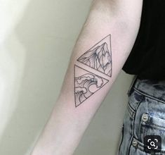 a man with a tattoo on his arm has a mountain and wave in the shape of a triangle