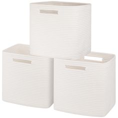 three white storage baskets stacked on top of each other