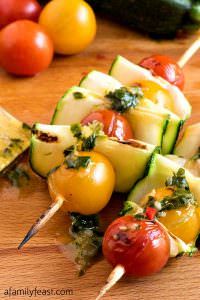 grilled vegetable kabobs on skewers with tomatoes and zucchini