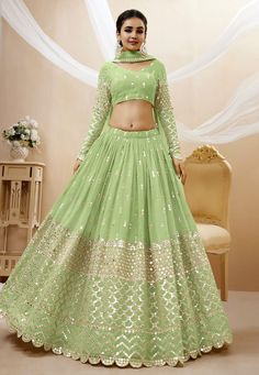 Pista green georgette circular lehenga choli 311 Desc: Style : Circular Lehenga Choli Color : Pista Green Fabric : Georgette Work : Embroidery Mirror Wash Care : Dry clean Sleeve Style : Full Sleeve Long Sleeves : Done only in Custom Stitch Sleeves Lining : Done only in Custom Stitch Bust Size : 32 to 42 Inches Occasion : Wedding Mehendi Sangeet Engagement Reception Ceremonial Baby Shower Teej. With Express Free Shipping Buy Lehenga - Indian Party wedding and bridal Pista g... Pastel Color Lehenga, Pista Green Colour, Sequin Lehenga, Green Lehenga Choli, Lehenga Choli Designs, Pista Green, Georgette Lehenga, Lehenga Wedding, Green Lehenga