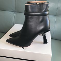 Color: Black True To Size Size: 9.5b / 39.5eu Chic High Heel Boots With Contrasting Heel Counter, Chic Boots With Contrasting Heel Counter, Chic Ankle Strap Heeled Boots With 4-inch Heel, Chic Heeled Boots With Ankle Strap And 4-inch Heel, Black High Heel Calf Leather Boots, Chic Ankle-high Heels With Contrasting Heel Counter, Chic Heeled Boots With Contrasting Heel Counter, Black Calf Leather High Heeled Boots, Chic Heeled Boots With Contrasting Heel