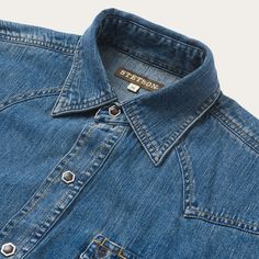 This premium Western shirt is constructed with contrast stitching and has a classic, loose cut for riding and outdoor activity. It’s made from 100% cotton that hangs well while keeping its shape and only gets better with age. Two snap-closure pockets, a spread collar, and a one-point curved back yoke and single point f Cheap Workwear Shirt With Shirttail Hem, Cheap Washed Blue Workwear Shirt, Affordable Levi's Shirt With Pockets, Cheap Washed Shirt For Workwear, Luxury Washed Button-up Shirt, Cheap Slim Fit Denim Shirt, Luxury Dark Wash Button-up Shirt, Western Style Medium Wash Shirt With Pockets, Western Denim Blue Relaxed Fit Shirt