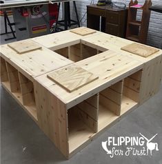 a table made out of wooden pallets in a garage