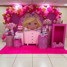 a barbie birthday party with pink and gold decorations, balloons and decorating on the wall