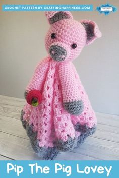 a crocheted stuffed animal wearing a pink and gray dress with text overlay that reads, pip the pig lovey