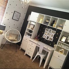 a white desk and chair in a room with polka dot wallpaper on the walls