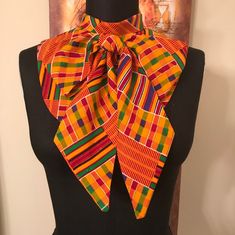 African Print Dickey with an 3-1/2" wide  attached Tie-Bow. Kente Print  Embellish your neckline with a detachable  Collar/Dickey. Bias roll collar, back button closure.  Wear under a crew, scoop or v- neck dress,  top, t-shirt, or sweater. Fits up to an 16" neck. Sangoma Attire Dresses, Adjustable Multicolor Standard Tie, African Fabric Accessories, Kitenge Designs, Kente Print, African Fabric Dress, African Accessories, African Inspired Clothing, Detachable Collar