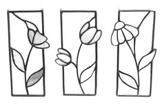 three metal flowers are shown in the shape of rectangles