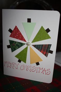 a christmas card with the words merry christmas in red, green and yellow on it