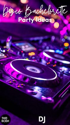 a dj's turntable with purple lights in the background