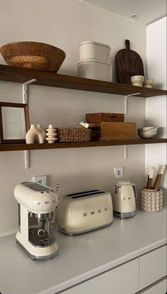 the kitchen counter is clean and ready to be used as a coffee maker or mixer