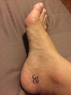 a person with a small tattoo on their foot