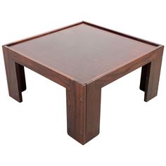 a square wooden table with two legs and a brown finish on the top, against a white background