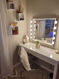 a white desk topped with a mirror and lights