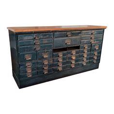 an old black metal cabinet with lots of drawers