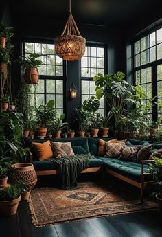 a living room filled with lots of plants