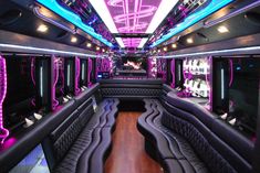 the inside of a party bus with purple and black seats, lights, and mirrors