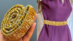 a woman is holding an object made out of gold wire and fabric, while another hand holds