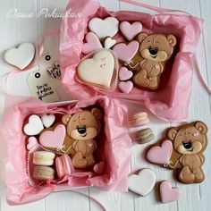 three teddy bears and cookies in pink boxes