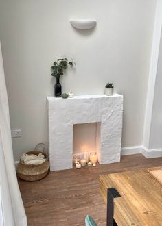 a living room filled with furniture and a fire place