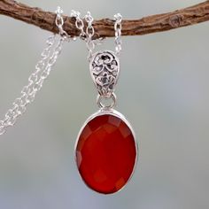 Crowned by sterling foliage, carnelian is radiant. Shanker crafts an elegant necklace to showcase the faceted oval gem. The stone totals 11 carats. .925 Sterling silver materials: Sterling silver, carnelian Cable chain Spring ring clasp High polish finish 18 in. L; 1 mm W; Pendant(s): 1.4 in. L x 0.6 in. W x 0.3 in. D Crown Pendant Necklace, Jewlery Necklace, Unique Fashion Jewelry, Crown Pendant, Kay Jewelry, Crown Necklace, Carnelian Jewelry, Carnelian Necklace, Carnelian Pendant