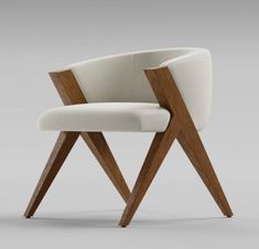 an upholstered chair with wooden legs and a white fabric seat pad on the back