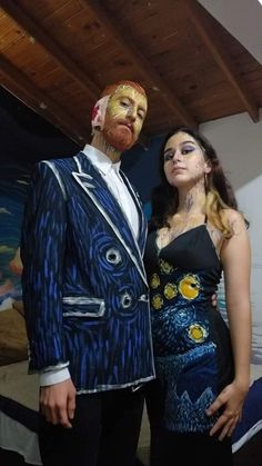 a man and woman dressed up in costumes