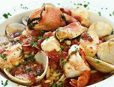 a white bowl filled with pasta and clams