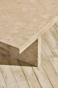 a close up of a table on a wooden floor with no one around it,