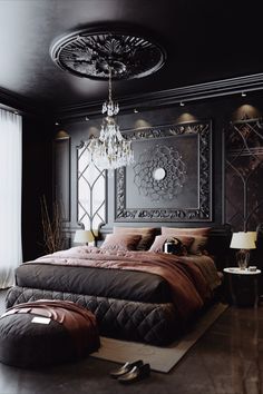 a large bed sitting under a chandelier in a bedroom next to a window