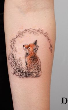 a small fox tattoo on the leg