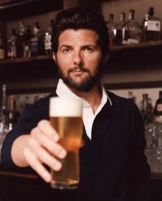 a man holding a beer in his hand