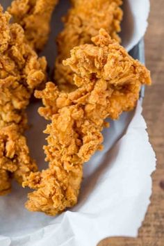 fried chicken sticks are on a plate and ready to be eaten