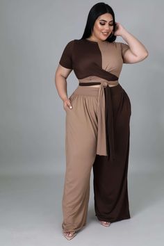 Two-piece set Crop top Round neckline Short sleeves Self-tie No closure High waisted pants Wide legs Pockets No closure 96% polyester 4% spandex Hand wash cold Model is wearing a 2X MODEL STATS Height: 5.6" Bust:34" / Waist:25" / Hips:41" Brown Wide Leg Pants Outfit, Crop Top And Sweats, Plus Size Crop Top Outfit, Jesenia Perez, Plus Size Teen, Plus Size Crop Top, Gala Outfits, Tan Outfit, Plus Size Crop Tops