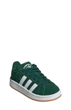 Serrated 3-Stripes and a heritage Trefoil stand out on this kid-size sneaker featuring plush cushioning on the tongue and cuff for a skate-inspired twist. Pull-on style with elastic laces Leather, textile and synthetic upper/textile lining/rubber sole Imported Adidas Green Skate Shoes With Three Stripes, Adidas Low-top Sneakers For School, Adidas Green Sneakers For Skateboarding, Adidas Sporty Sneakers For School, Green Skate Shoes With Three Stripes And Round Toe, Green Skate Shoes With Three Stripes Branding, Sporty Adidas Sneakers For School, Casual Adidas Sneakers With Round Toe, Adidas School Sneakers